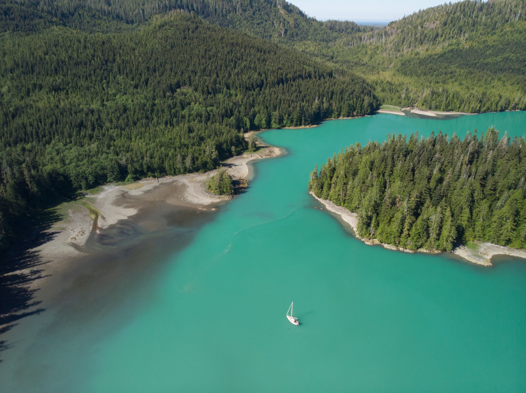 Jura at anchor in the glowing turquoise water of Whitepine Cove
